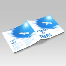 A mockup template of a brochure with a blue sky and a bird flying. - PSD Mockup