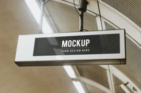 A mockup template of a subway sign in a subway station. - PSD Mockup