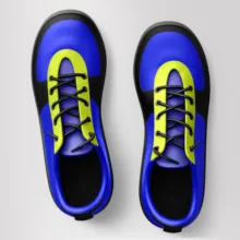 A mockup template displaying a pair of blue and yellow shoes on a white background. - PSD Mockup