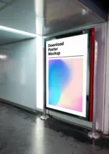 A colorful poster mockup on a billboard in a subway station. - PSD Mockup