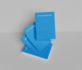 A stack of blue notebooks on a white surface, perfect for showcasing a mockup or template. - PSD Mockup