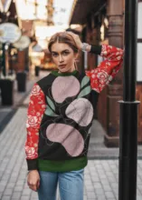 A woman wearing a sweater with flowers on it serves as the perfect template for a mockup. - PSD Mockup